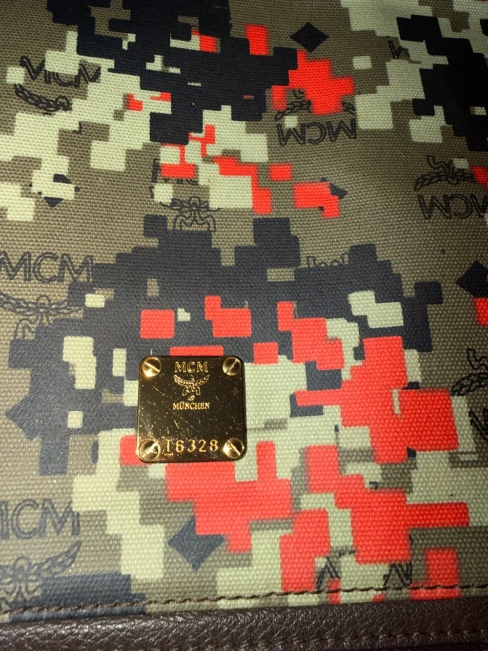 MCM laptop portfolio with brown leather trim and digital camo fabric